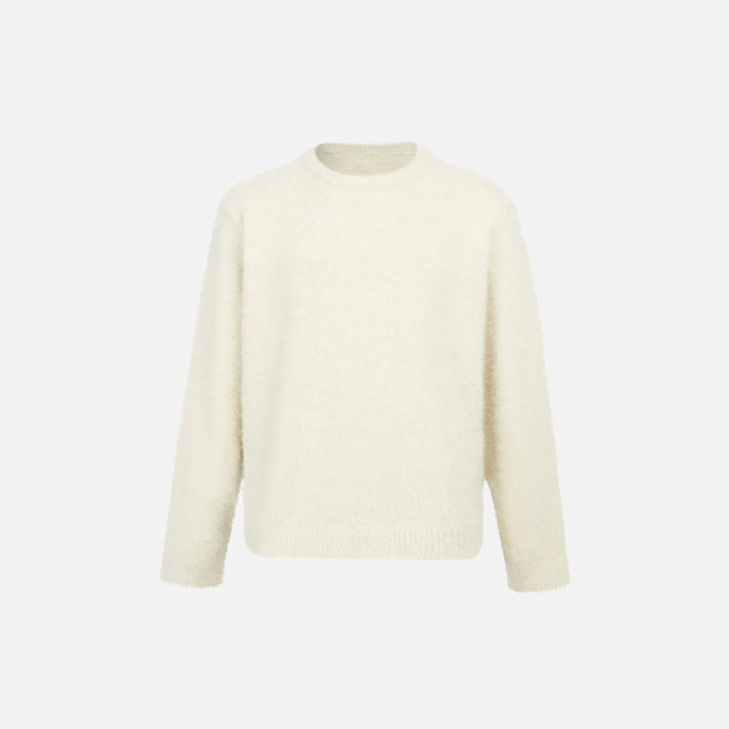 Front view of the apricot Classic Crew Neck Sweater in a gray background