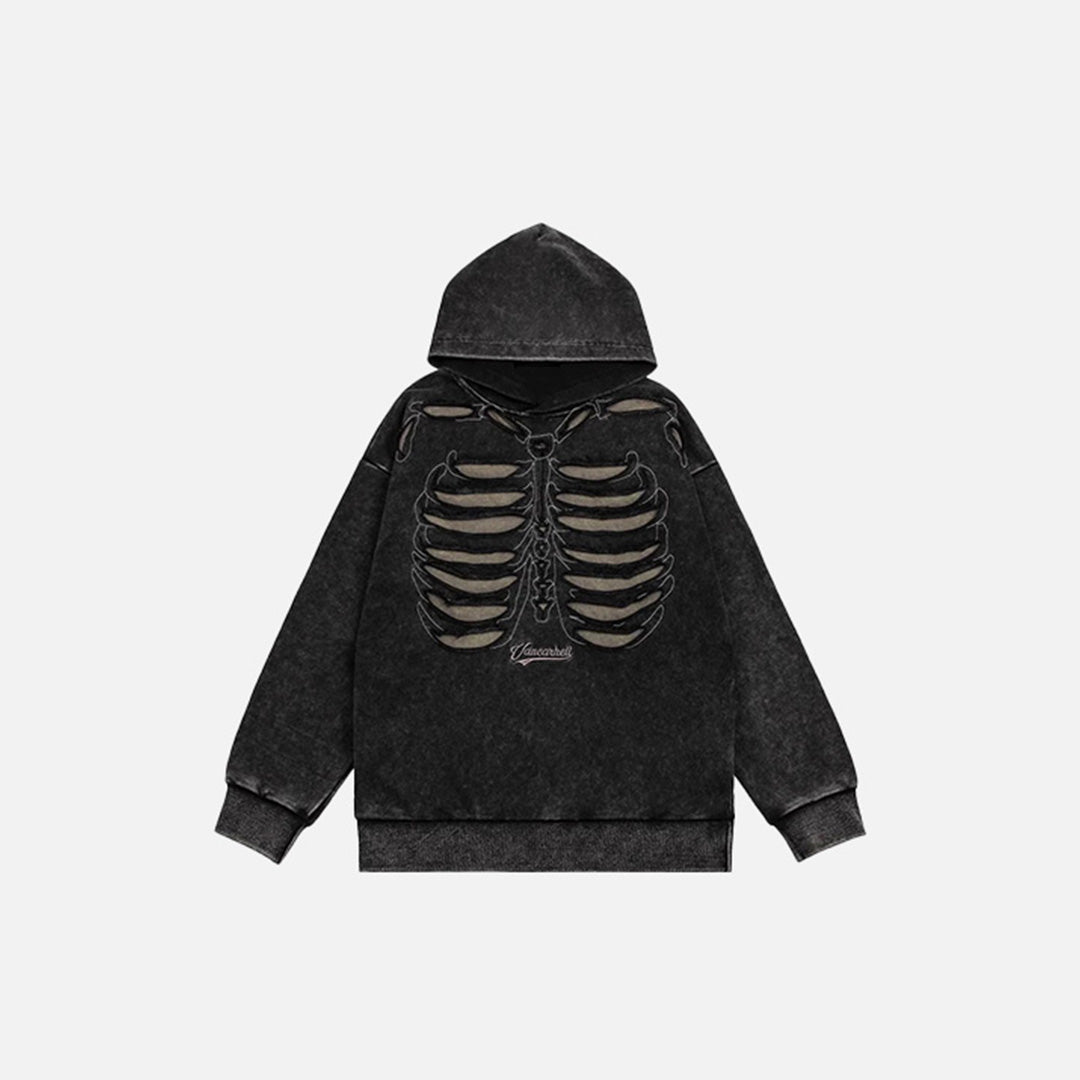 Front view of the black Y2K Skeletal Spine Hoodie in a gray background