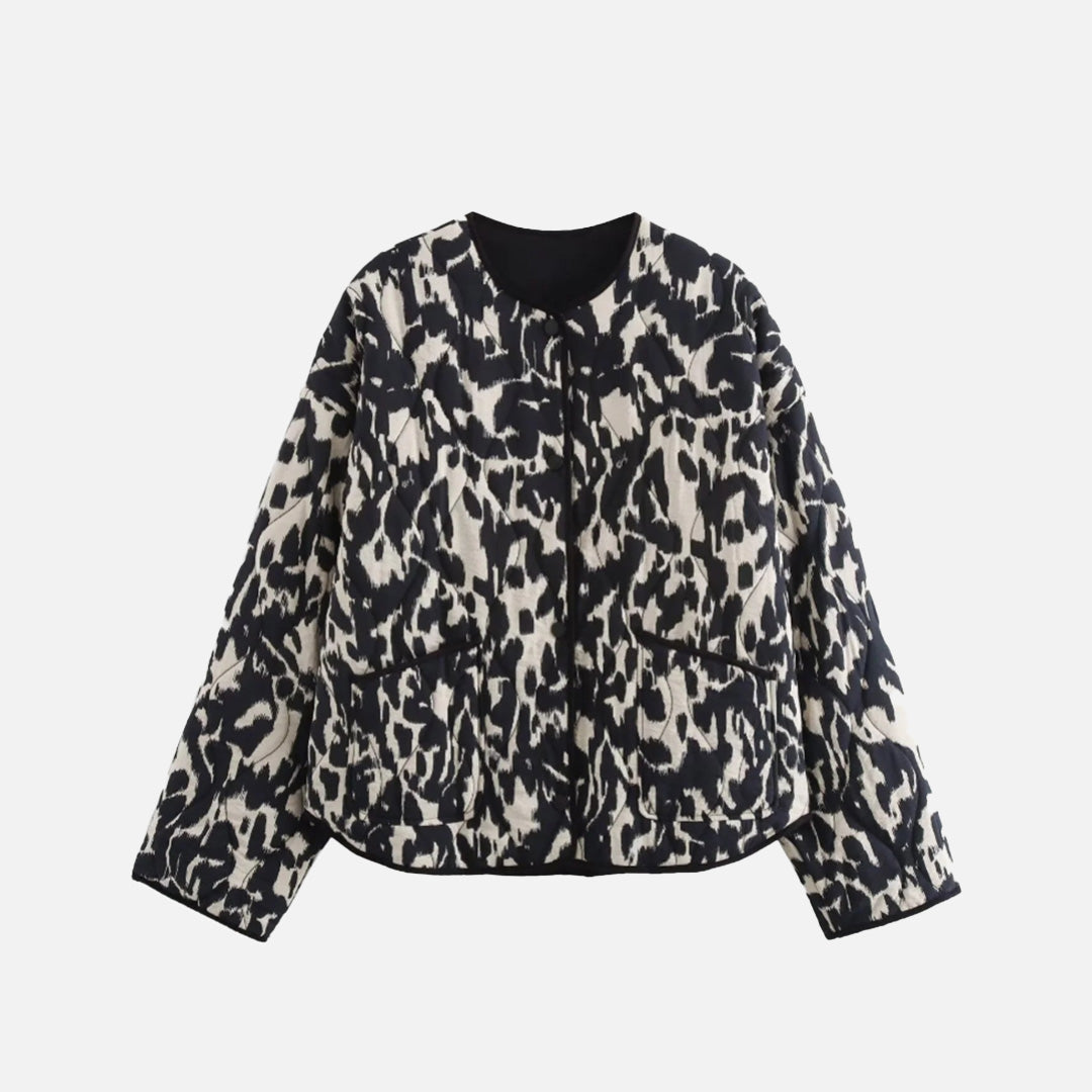 Front view of the black Enchanted Weave Jacket in a gray background