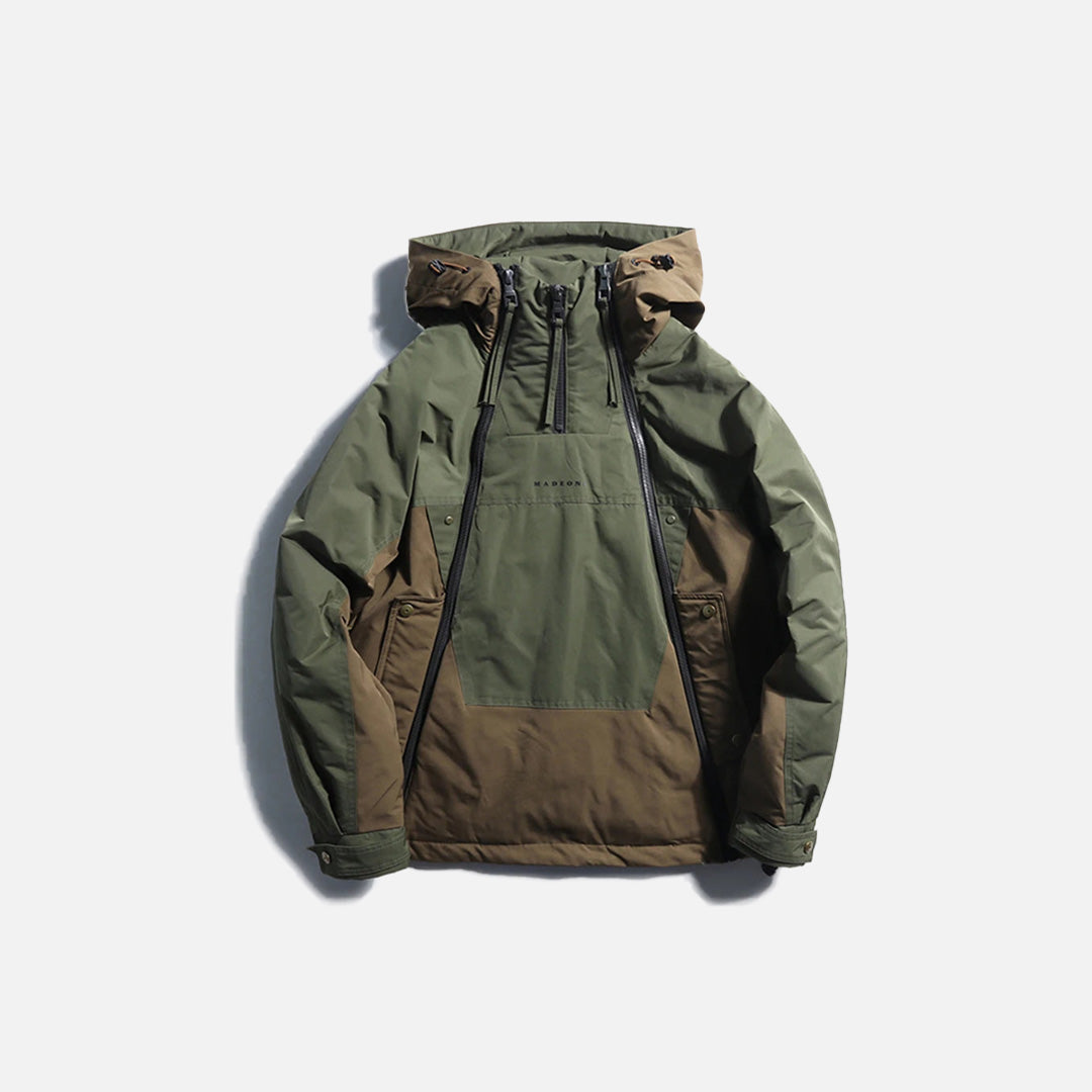 Front view of the army green Summit Explorer Jacket in a gray background