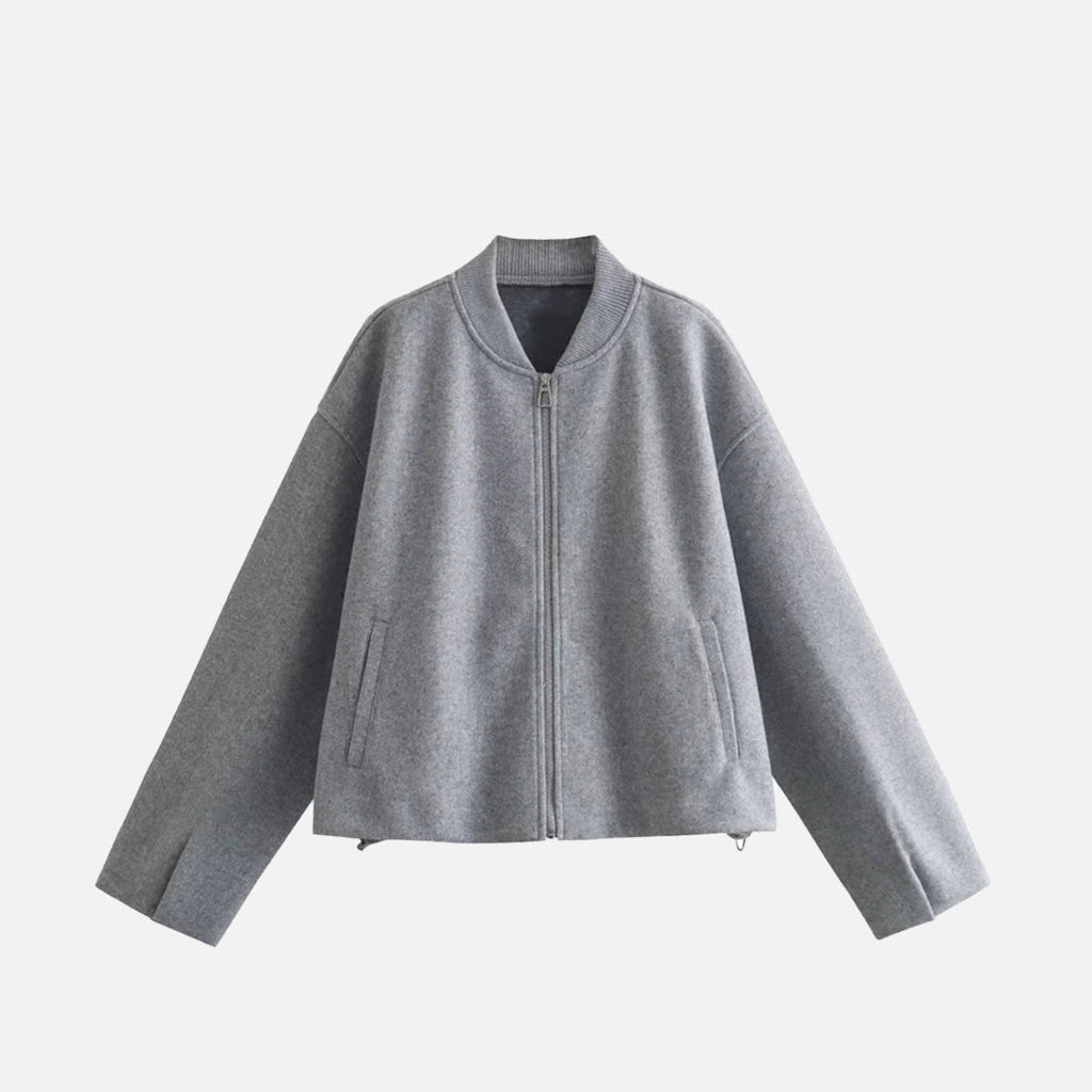 Front view of the gray Ethereal Quilted Embrace Jacket in a gray background