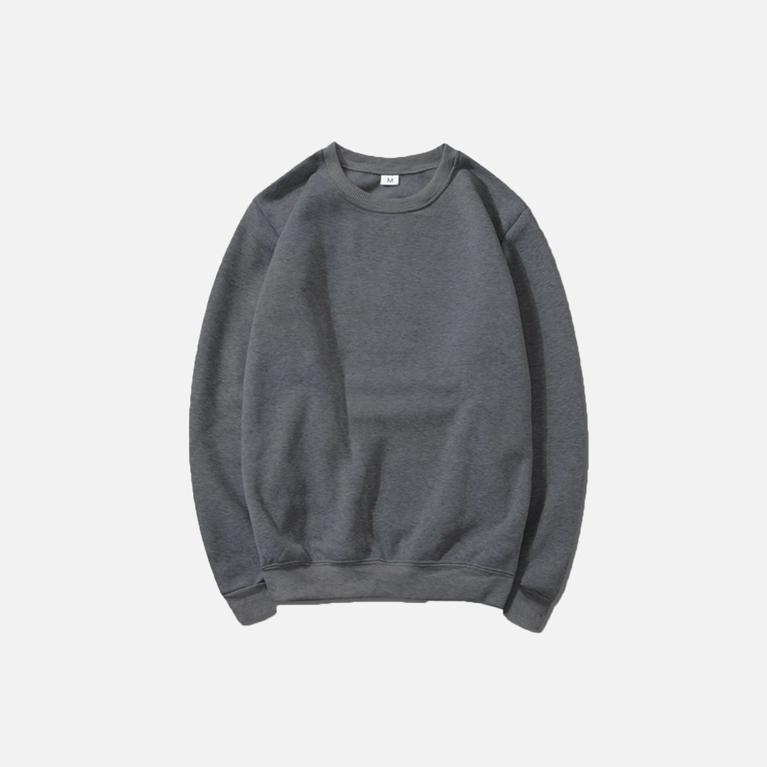 Front view of the dark gray Essential Pullover Sweatshirt in a gray background