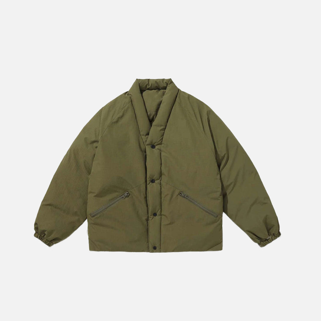 Front view of the olive green Minimalost Boxy Jacket in a gray background