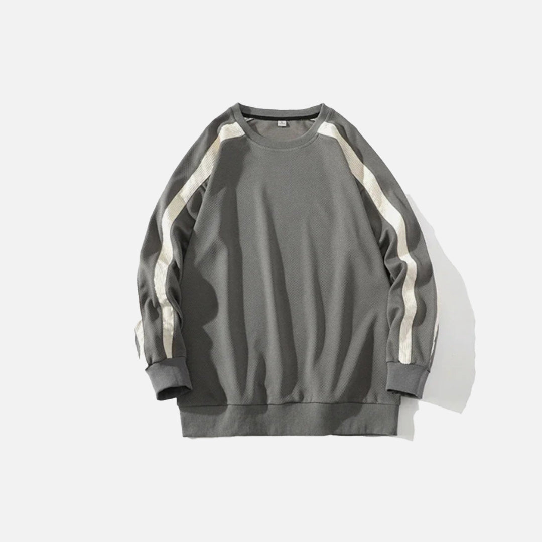 Front view of the grey Y2K Edge Track Sweatshirt in a gray background