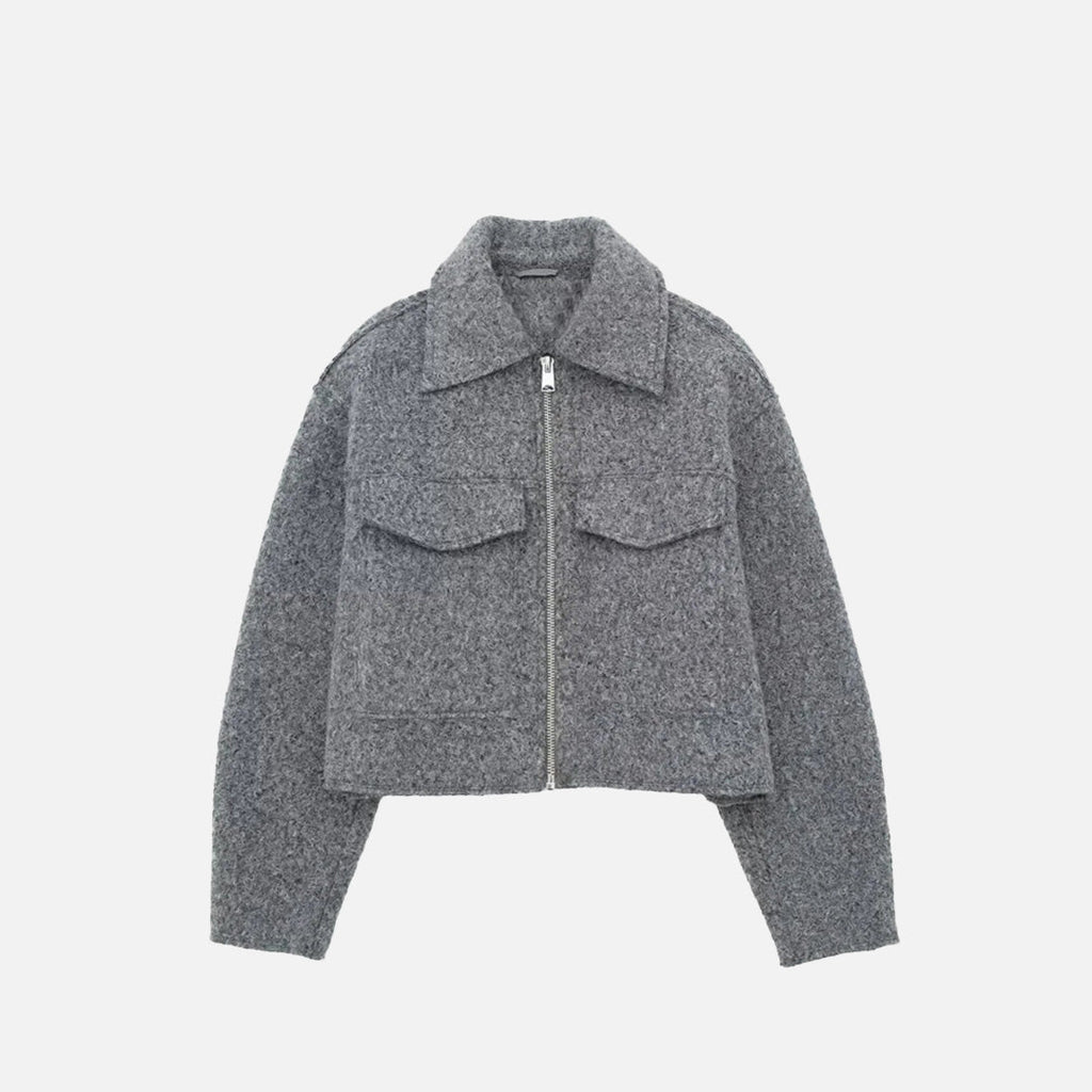 Front view of the grey Quilted Utility Jacket in a gray background