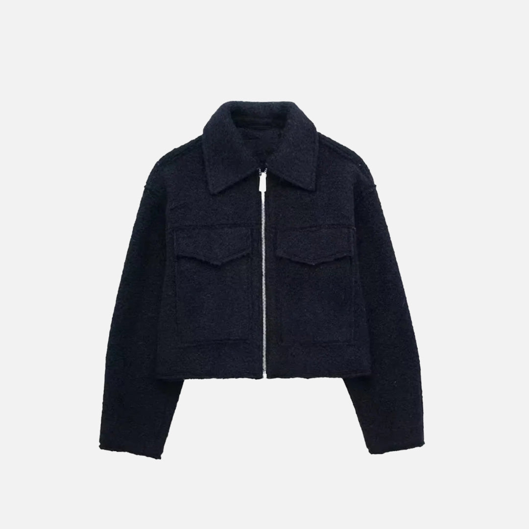 Front view of the navy blue Quilted Utility Jacket in a gray background