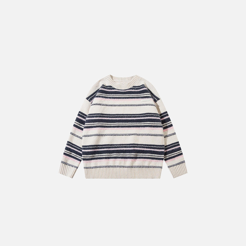 Front view of the apricot Striped Loose Sweater in a gray background