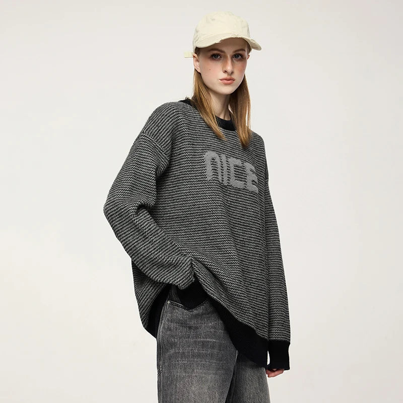 Model wearing the gray NICE Slogan Sweater
