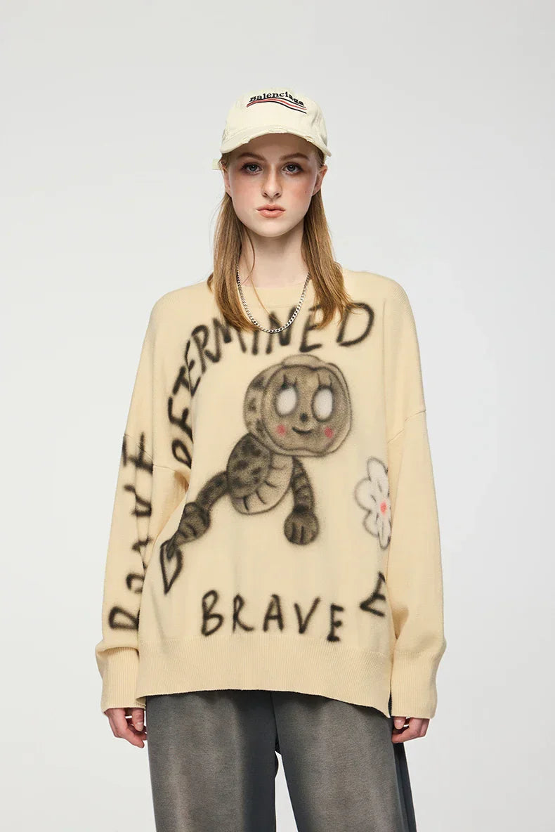Model wearing the apricot Illustrated Graphic Sweater
