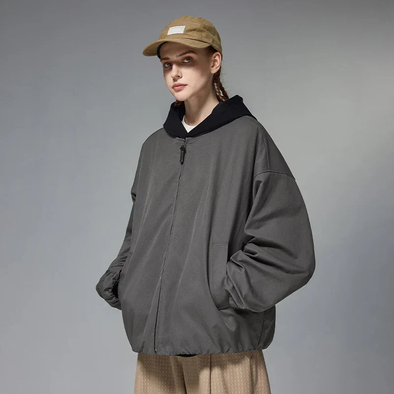 Model wearing the gray Zip-Up Quilted Jacket