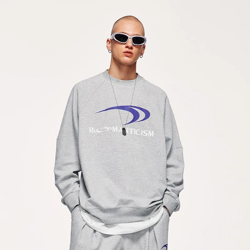 Model wearing the light grey Modern Romanticism Sweatshirt in a gray background