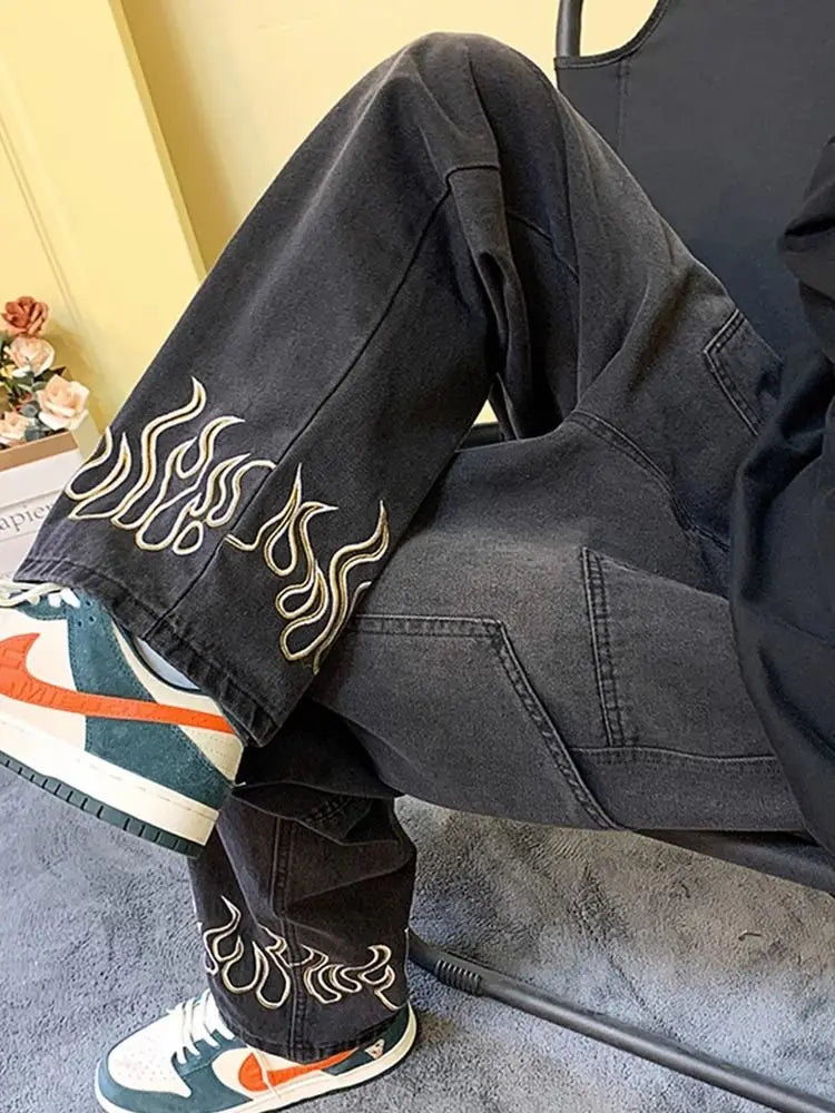 Model wearing the black Flame Detail Cargo Jeans 