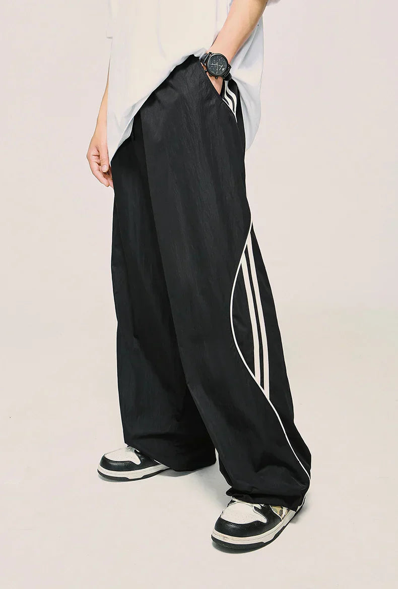 Model wearing the black Loose Side Striped Baggy Pants