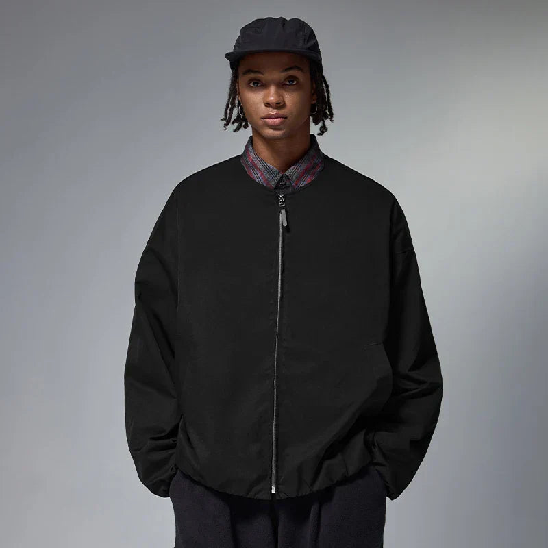 Model wearing the black Zip-Up Quilted Jacket