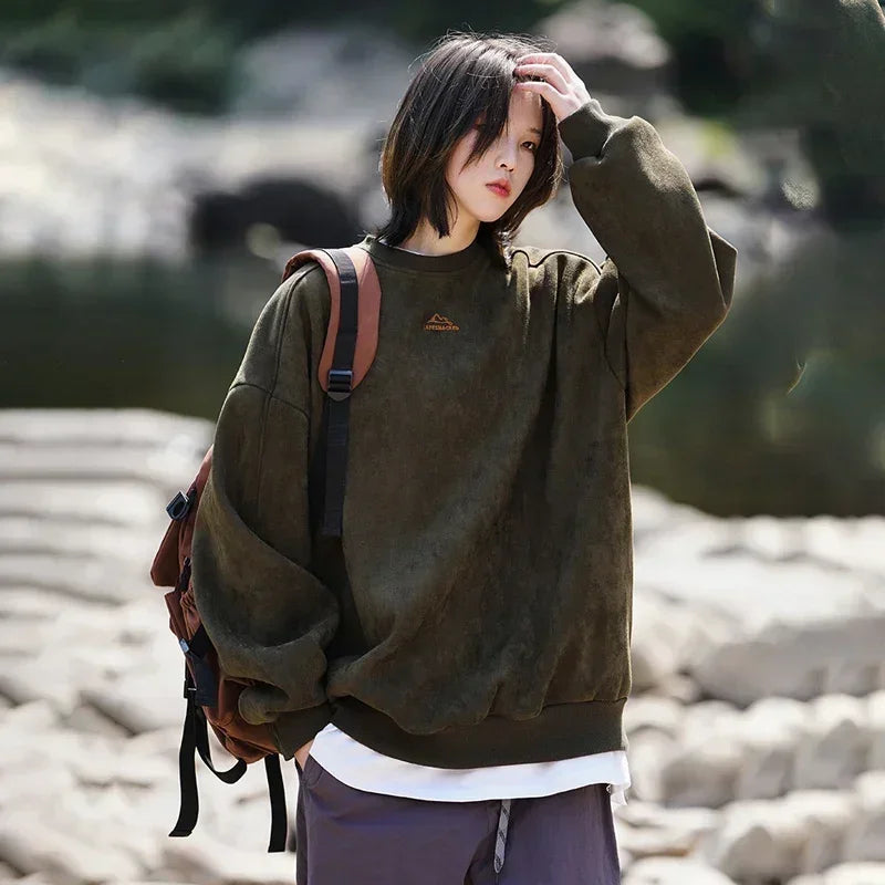 Model wearing the green Y2K Peak Drift Sweatshirt