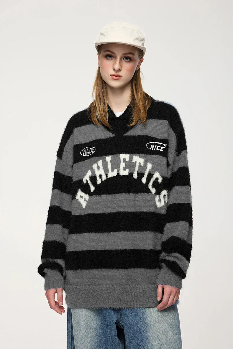 Model wearing the black Striped Athletic Sweater 